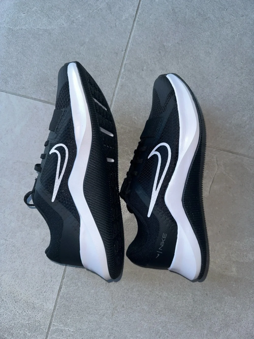 Nike Black Athletic Shoes with White Swoosh